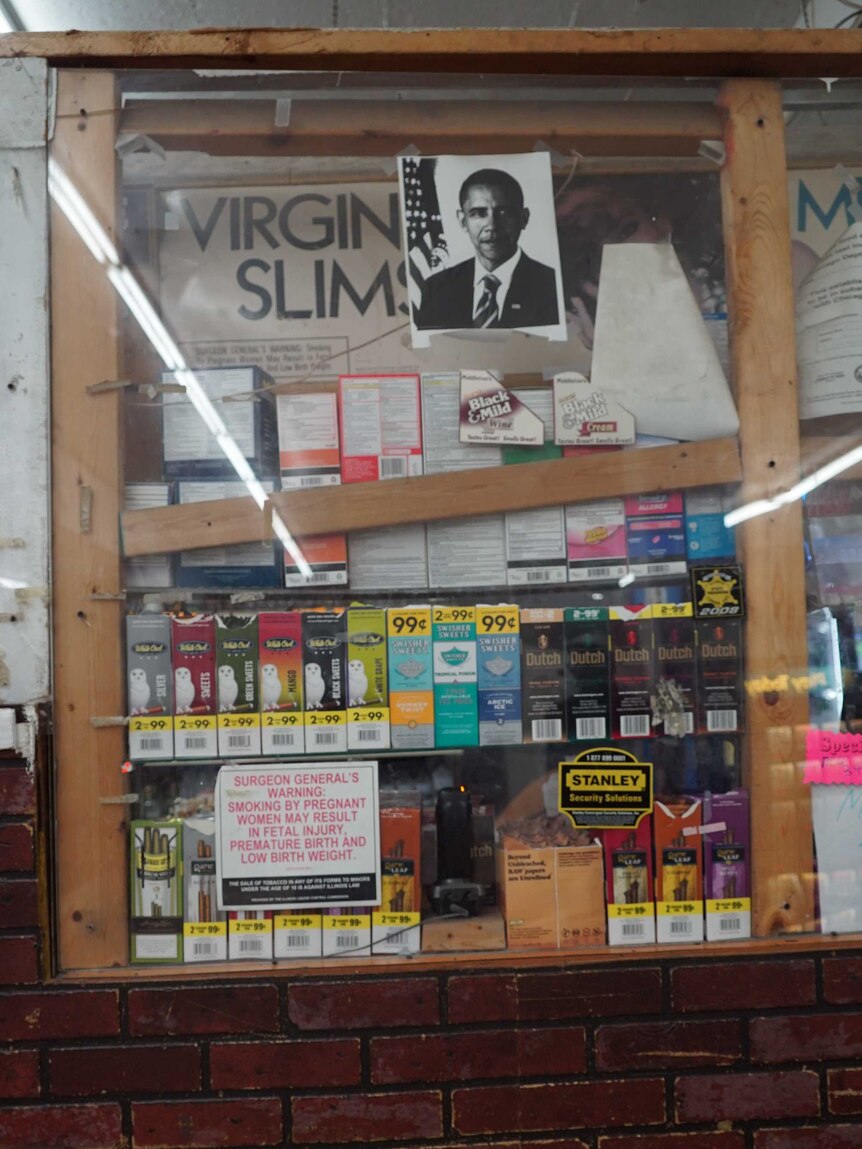 Photo of Obama taped to window above cigarette packets