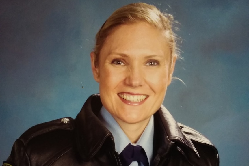 A female police officer in uniform.