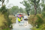 A car stranded in a flooded creek at Yeppoon