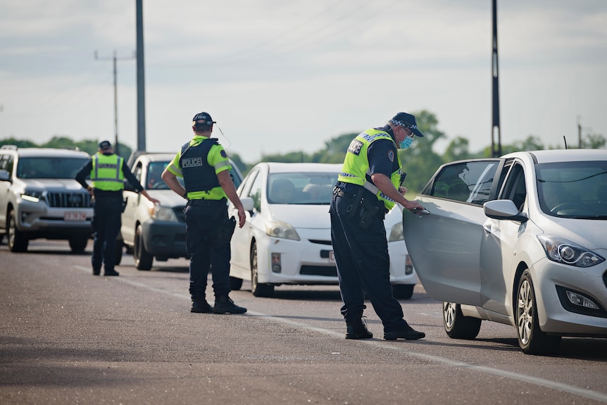 Police check cars near the Howard Springs quarantine facility in Darwin's rural area. 