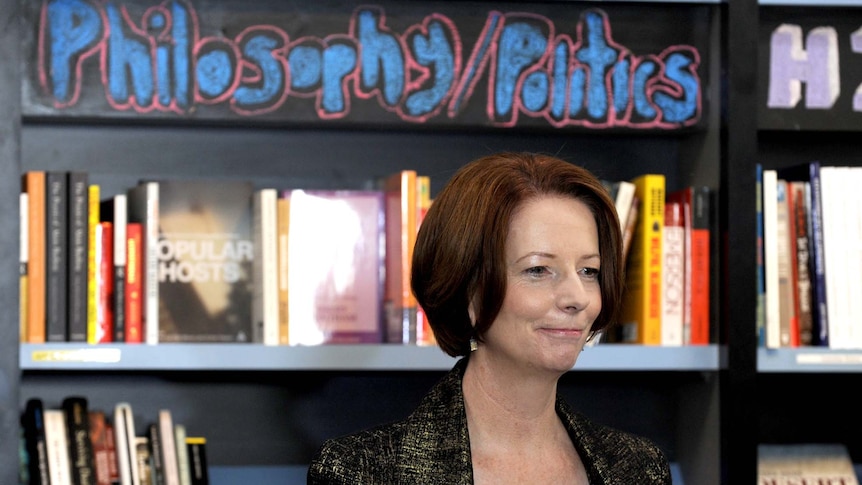 Julia Gillard looks through a bookshop in Canberra
