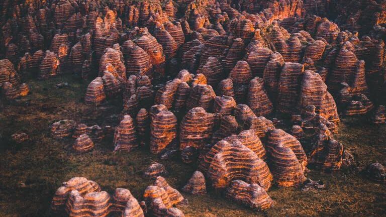 an aerial view of Purnululu's famous beehive shaped striped domes