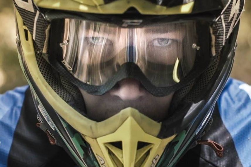 Matthew Phillips close-up in helmet.