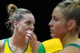 Diamonds goal-attack Kiera Austin rubs her chin while standing on the court during a Netball World Cup match against England.