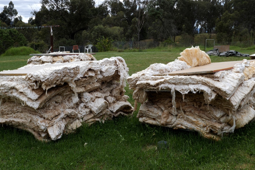 Two pallets of earth-wool insulation swollen and falling apart