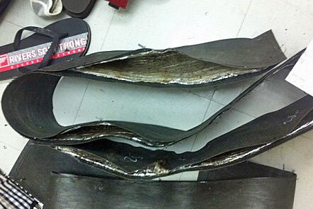 Leather straps allegedly containing heroin found in the luggage of two Australians at Vietnam's Ho Chi Minh Airport