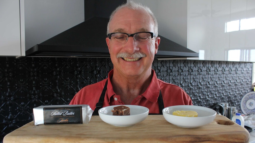 Jardin Estate's Nick Power smiles at a board of butter samples