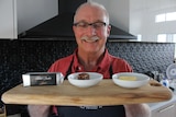 Jardin Estate's Nick Power smiles at a board of butter samples