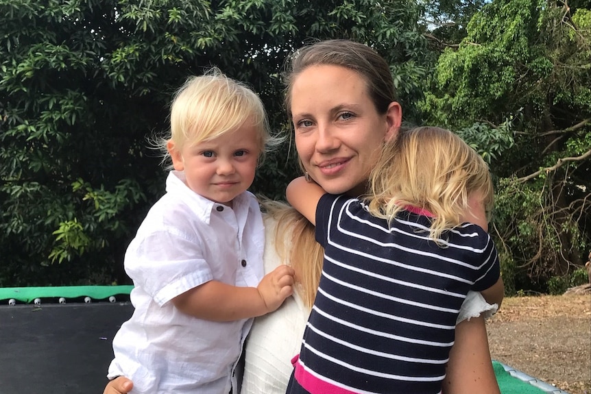 Katharina Gorka with son Manu (l) and Maya (r) who has her back to the camera