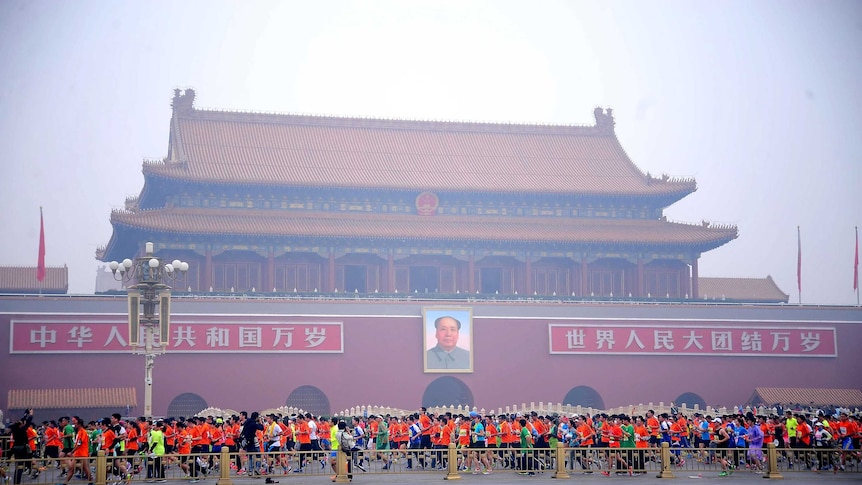 Runners in the Beijing mararthon at Tiananmen Square