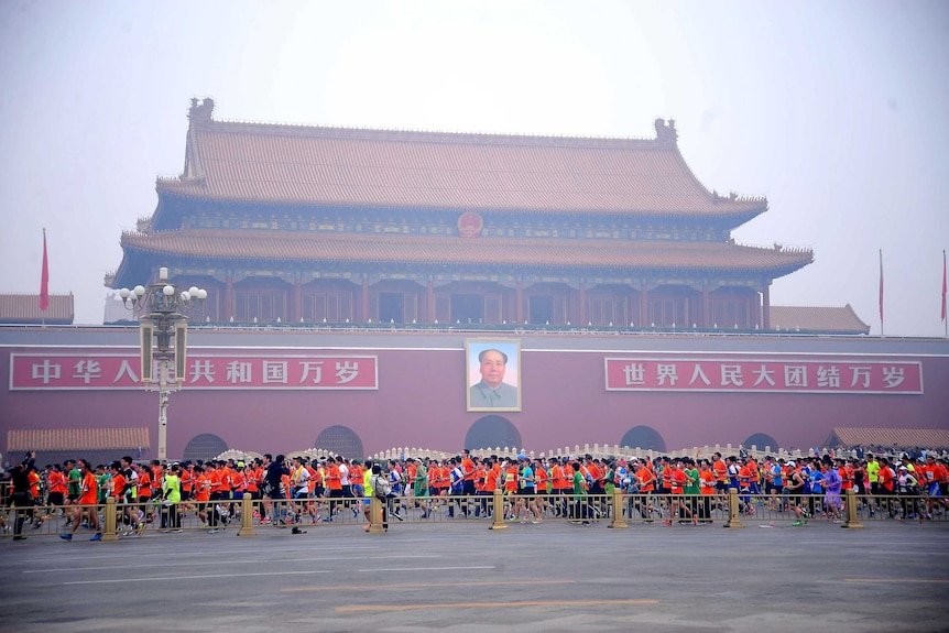 Runners in the Beijing mararthon at Tiananmen Square