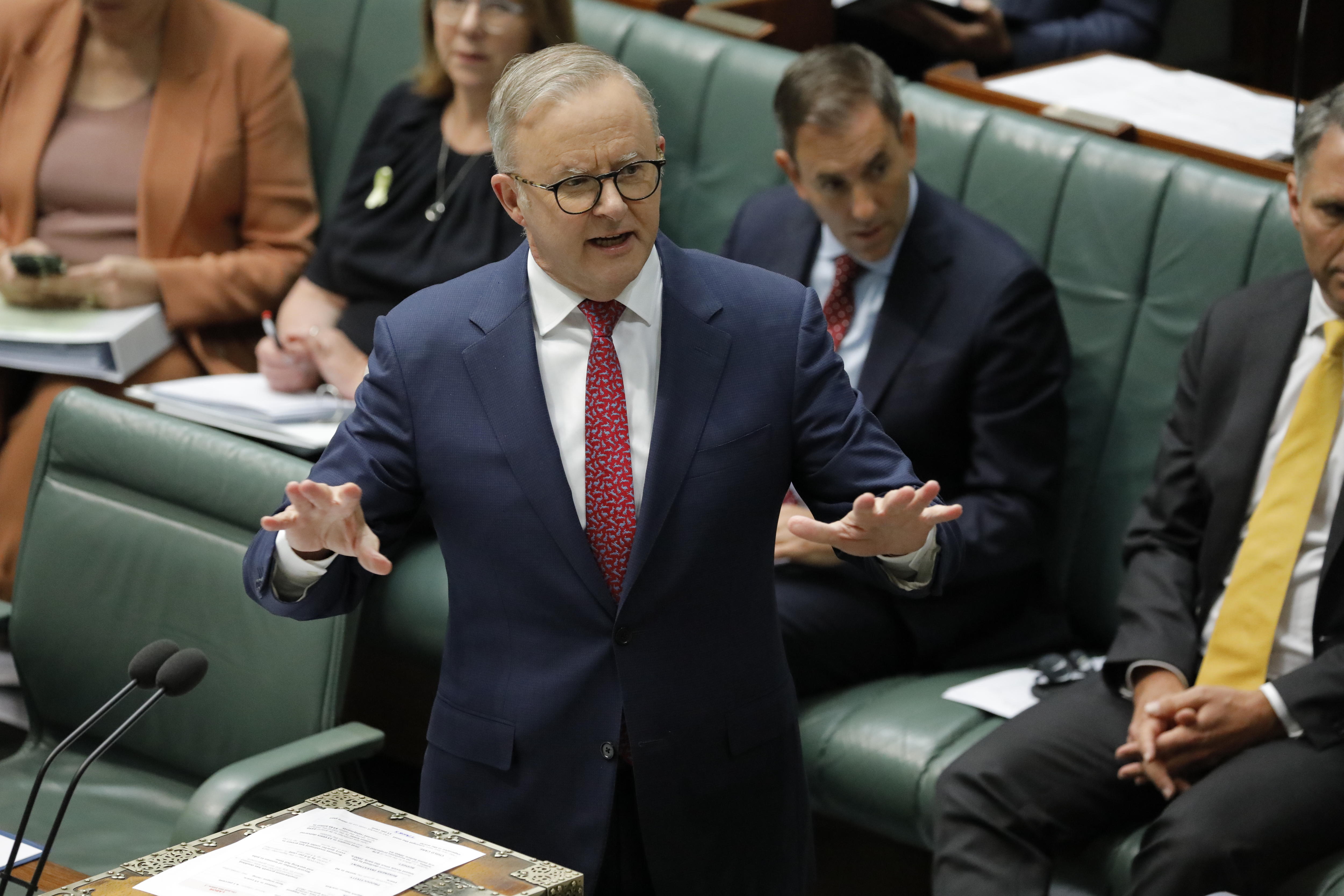 Anthony Albanese speaking with his arms held out. 