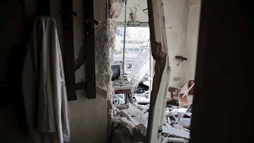 Debris litters an apartment on the front line damaged in recent fighting in Aleppo