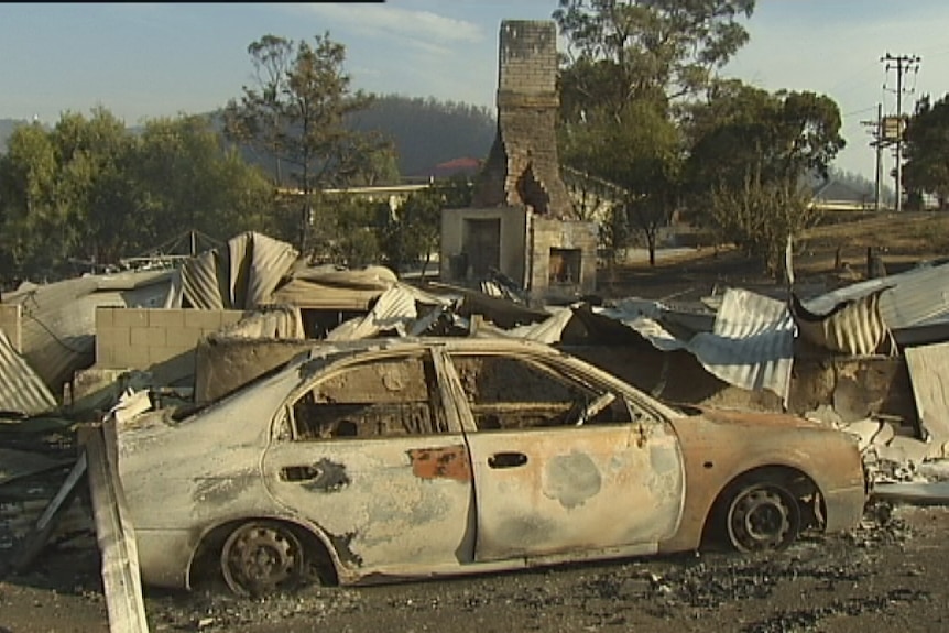 The report says 320 properties had to cleaned up after the 2013 bushfires.