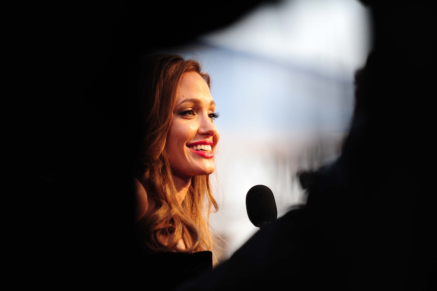 Angelina Jolie arrives on the red carpet for the 84th annual Academy Awards