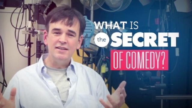 Tim Ferguson stands in studio, text reads "What is the secret of comedy?"