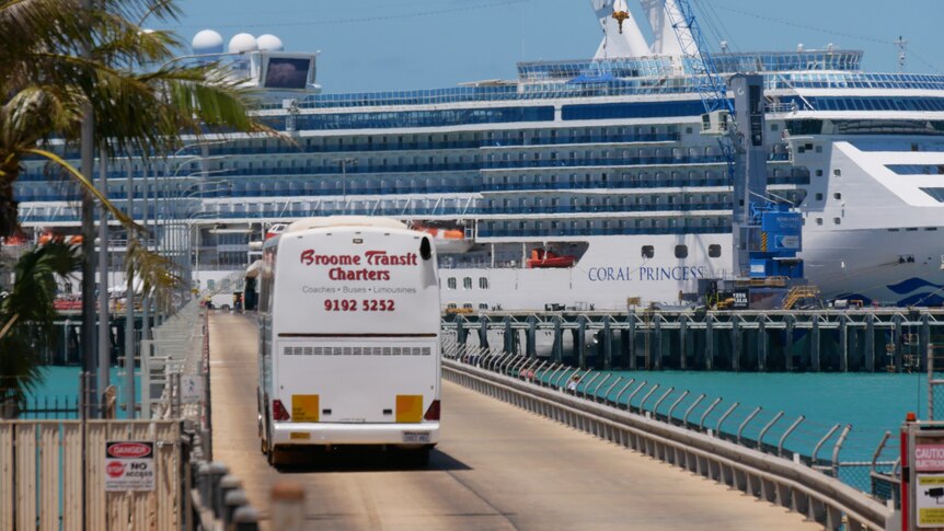 Image of a large tour bus driving down the jetty at Broome Port