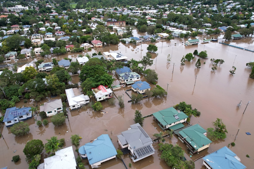 An aerial shot of a town filled with floodwater.