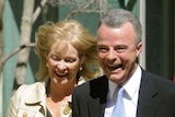 Former Liberal Party leader Brendan Nelson walks to a press conference with his wife Gillian