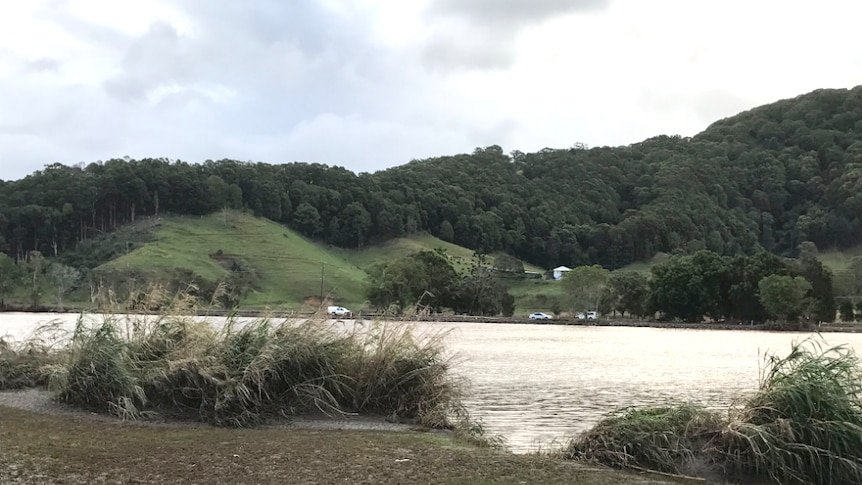 River with police on the far bank