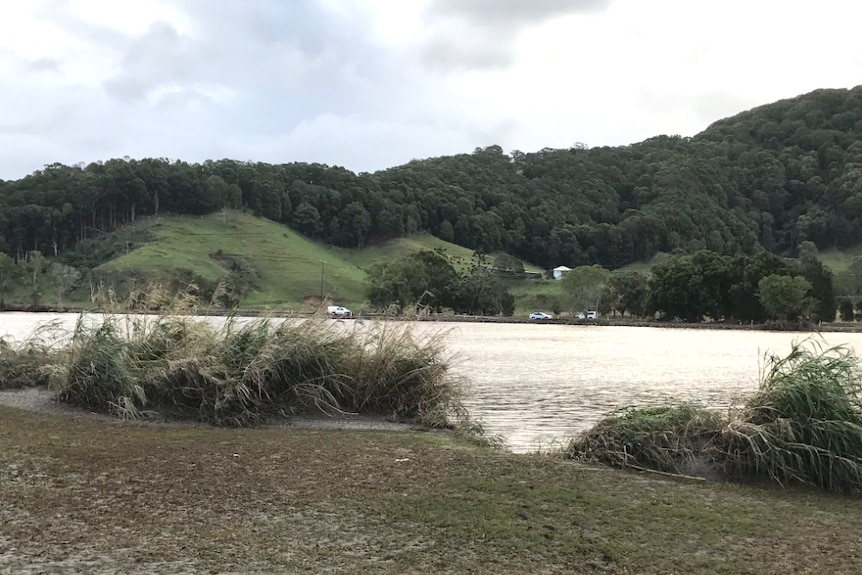 River with police on the far bank