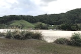 River with police on the far bank