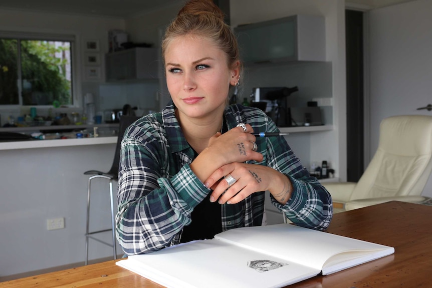 Grace Tame at her desk