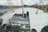 The white-domed roof of the O2 arena is seen damaged by the wind.