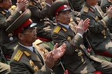 Loyalty vow ... North Korean soldiers applaud at the official ceremony.