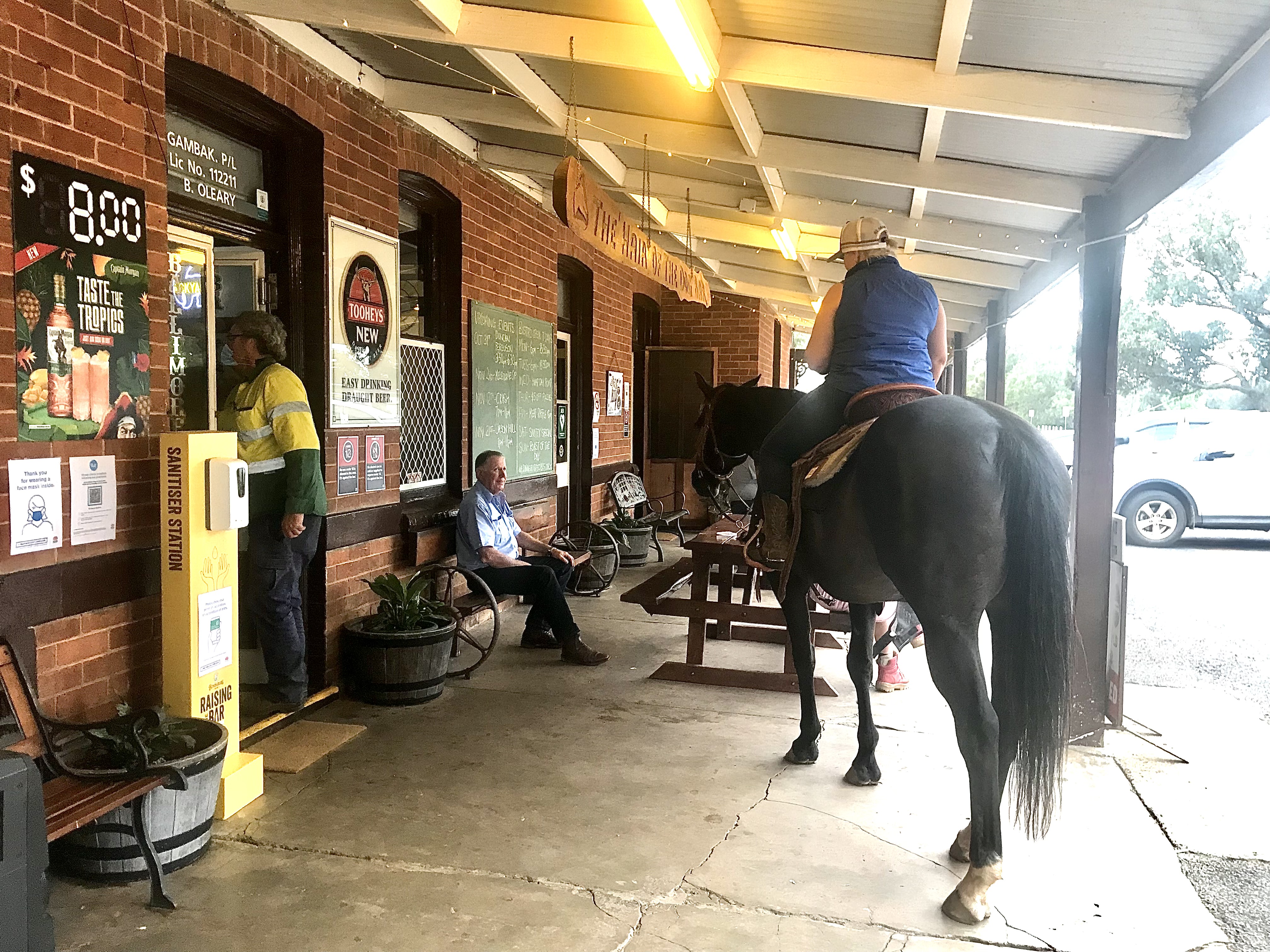 A horse and rider on the verandah of the Ballimore pub.