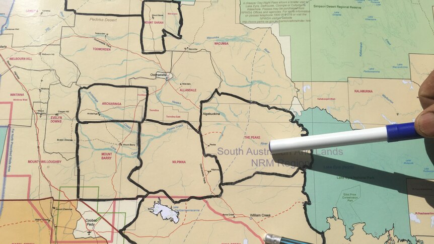 Pens pointing to a map showing the properties the Williams family will buy