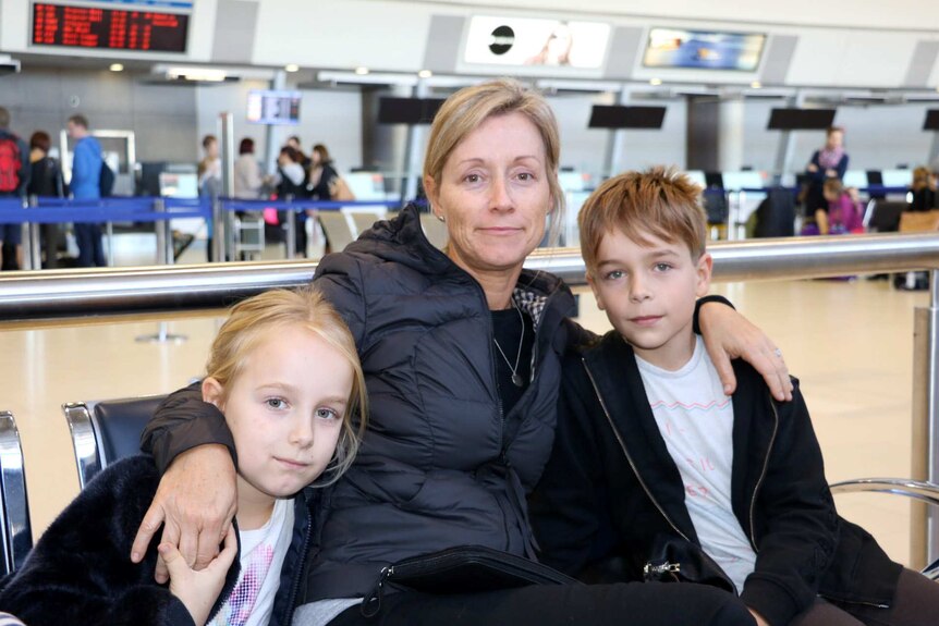 Jo Daw and her children at Perth airport