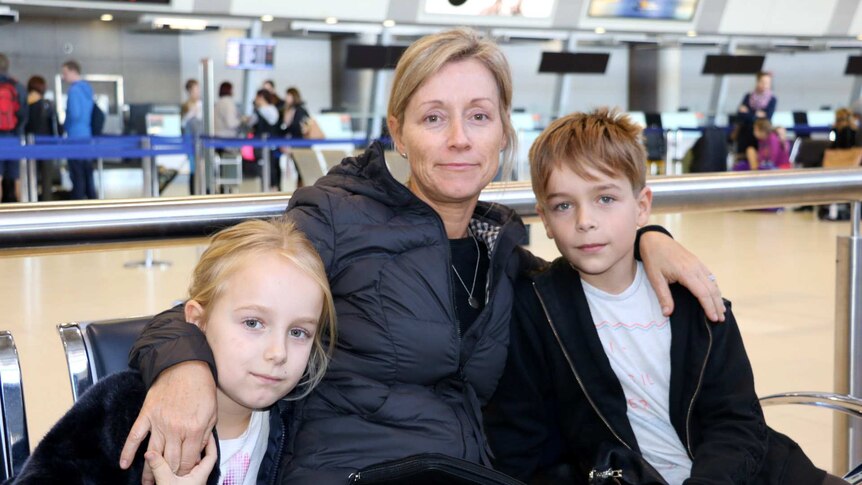 Jo Daw and her children at Perth airport