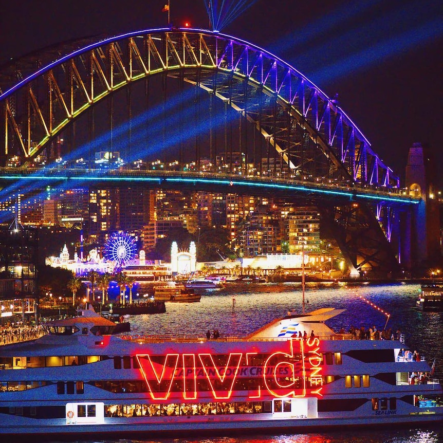 The lights of the Sydney harbour bridge and boats during the Vivid Festival.