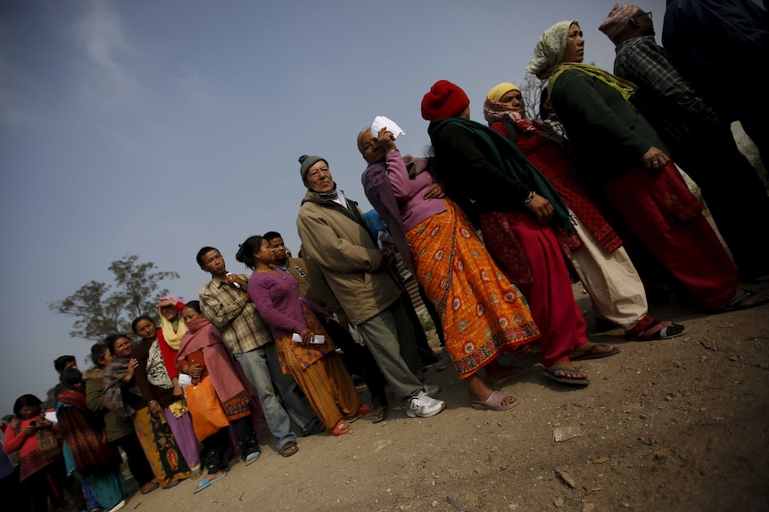 People queue to buy firewood as a respite for the ongoing fuel shortage.