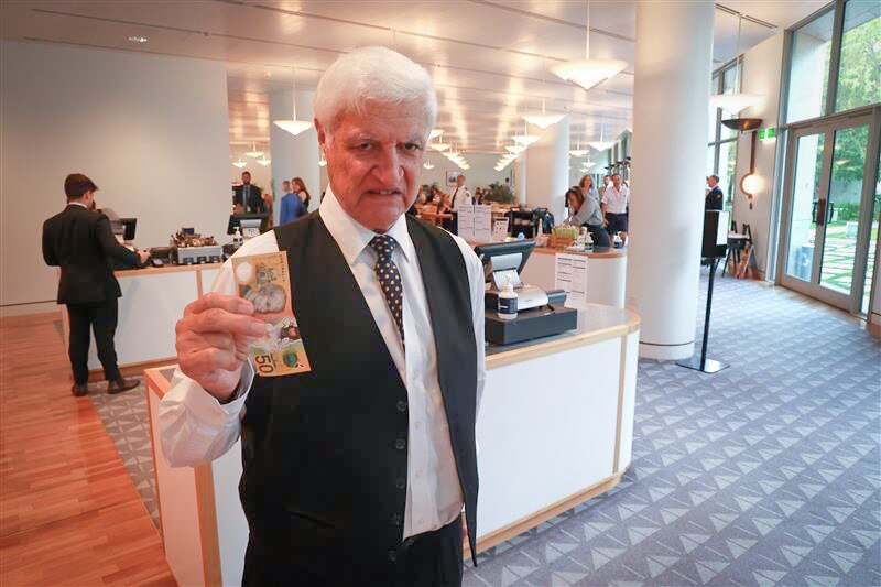 A man with a $50 note