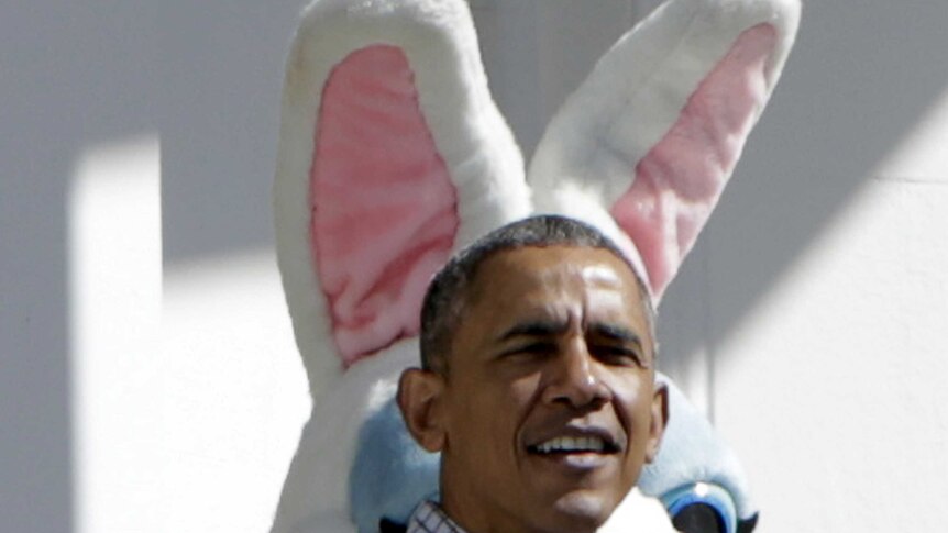 Former US president Barack Obama with the Easter bunny standing behind him.