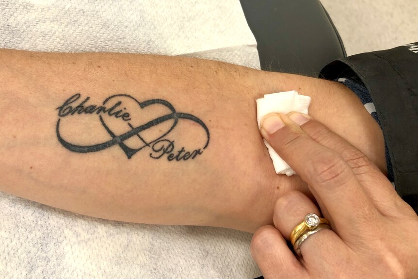 Charlie and Peter's names are entwined in a love heart design in the tattoo on Mary's arm, near where the needle went in.