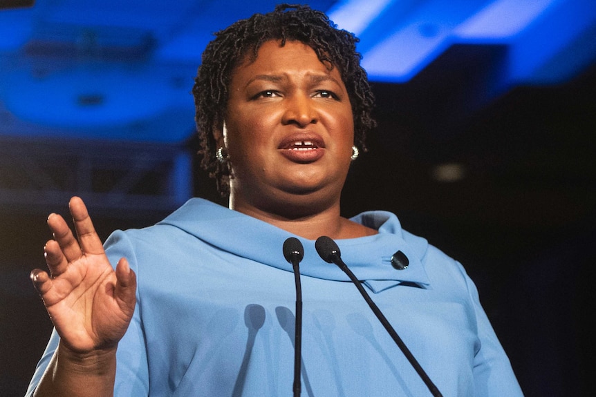 Stacey Abrams at the podium.