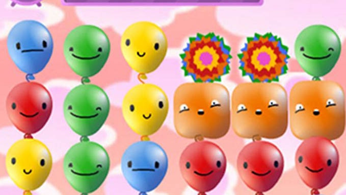 Screen shot of the Pop pop rush game. A grid of different coloured balloons with faces.