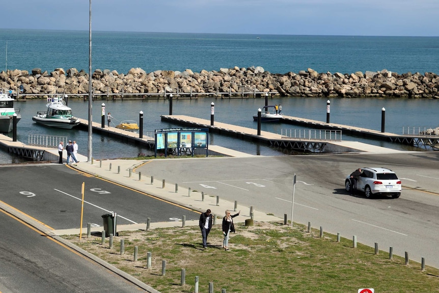 A car park and a number of small jetties at the site of the planned new marina.