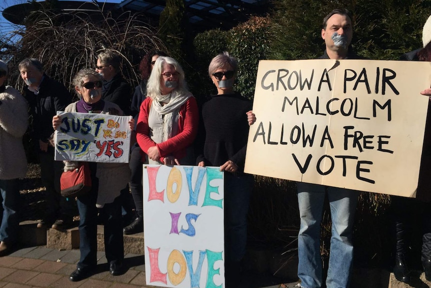 Pro same-sex marriage advocates outside the Tasmanian Liberals state conference, August 19, 2017.