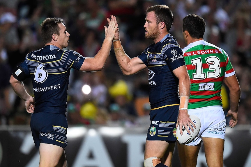 Gavin Cooper and Michael Morgan celebrate a try against the Rabbitohs