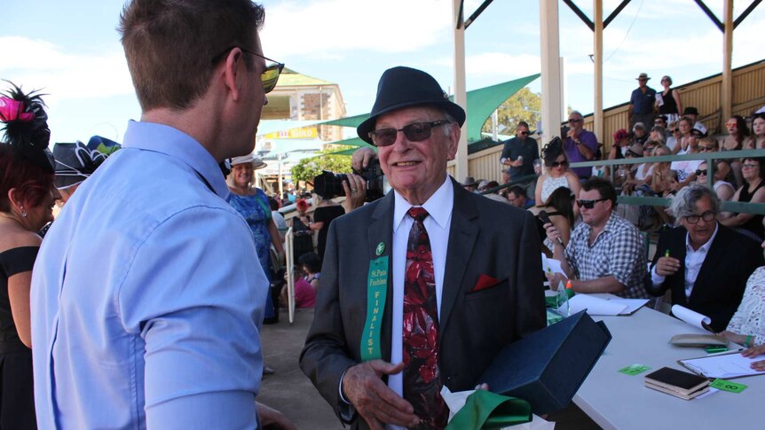 A winner in the Fashions on the Field competition, George Cole, wearing a suit and tie at the 2017 St Pats races.