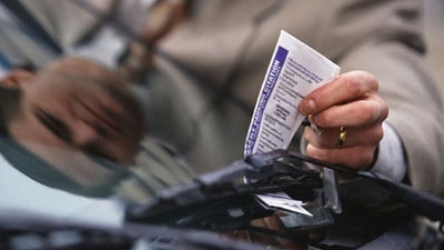 Parking ticket removed from car window