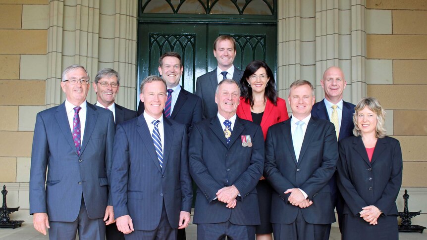 Tasmania's new cabinet stands outside Government House.