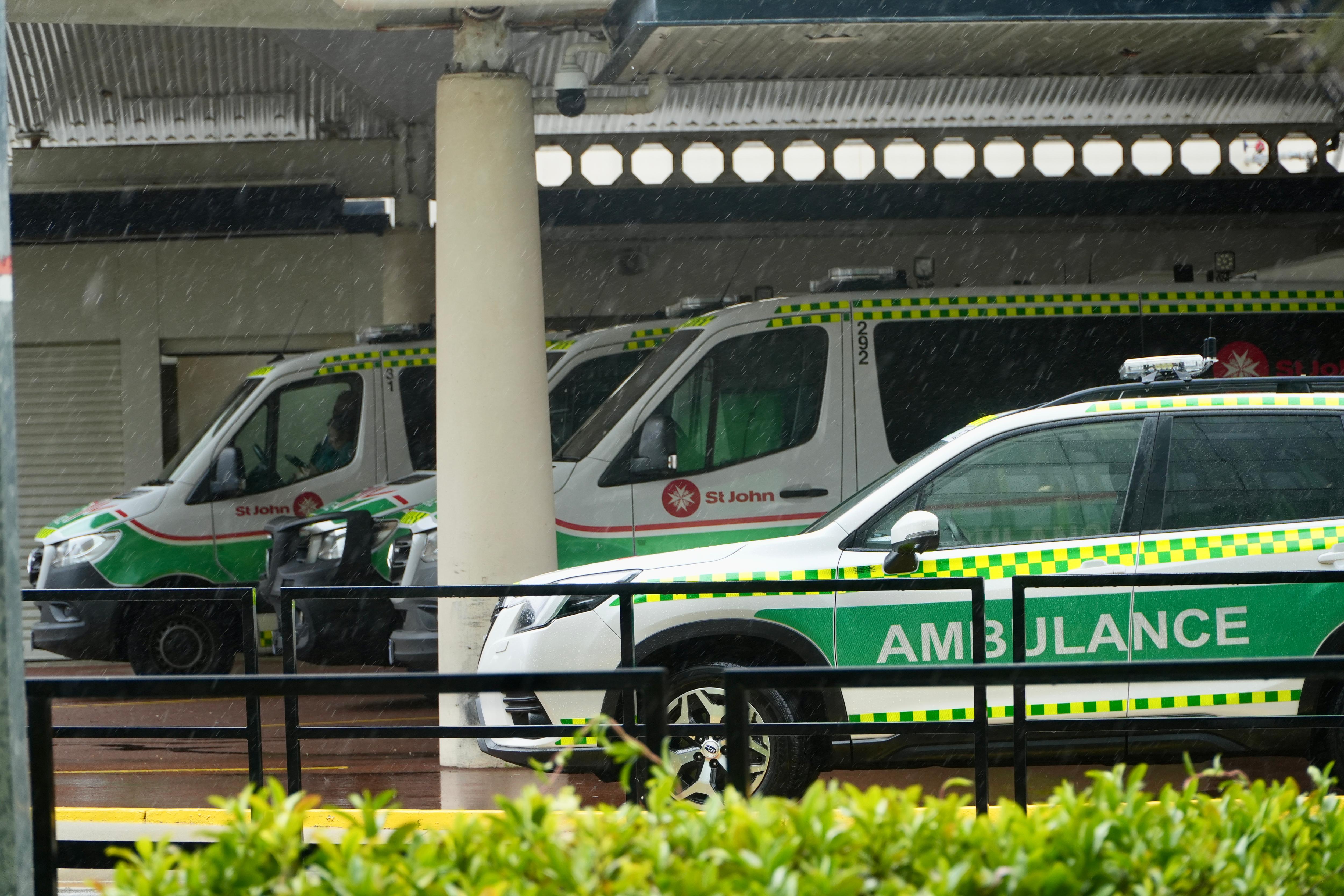 Ambulances parked outside a hospital. 