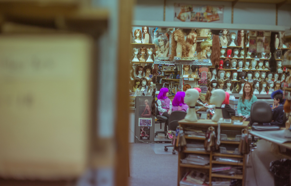 Eva sitting in the wig store.