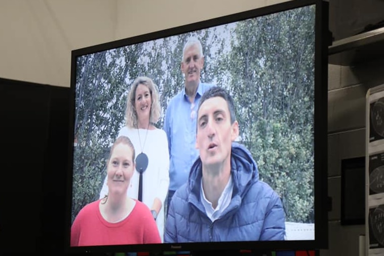 Two females and two males deliver a pre recorded message on TV