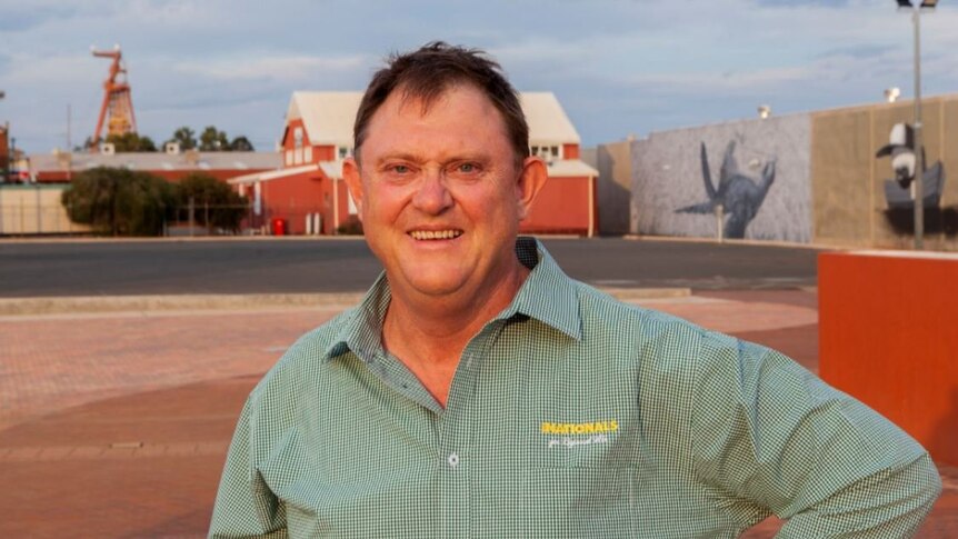 Senate candidate Nick Fardell standing in the street of a mining town